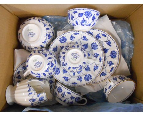 A Spode bone china part tea set decorated in the 'Colonel' pattern with blue printed foliate decoration including cups and sa