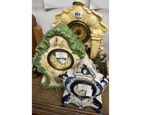 Two Edwardian ceramic cased timepieces - sold with a modern similar in the Delft style with mechanical alarm movement - vario