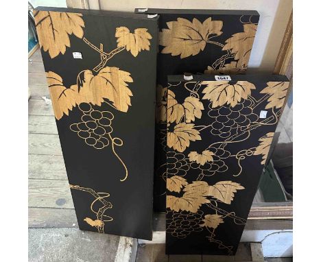 A modern incised mixed wood triptych wall art decoration, with stylised grapevines on a black background - each panel 90cm X 