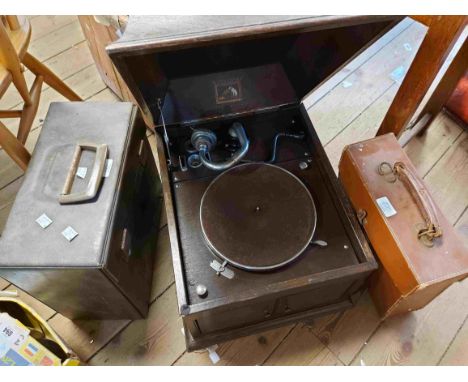An old oak cased HMV gramophone - sold with two cases of 78rpm records