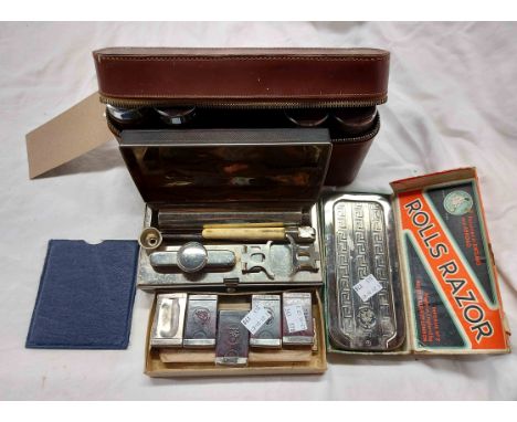 A vintage brown leather cased lady's part vanity set with chrome plated topped Bakelite bottles - sold with a bag containing 