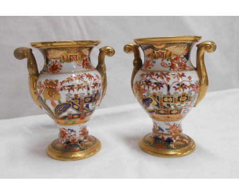 A pair of early 19th Century Spode bone china vases of urn form with hand painted Imari style decoration - various condition