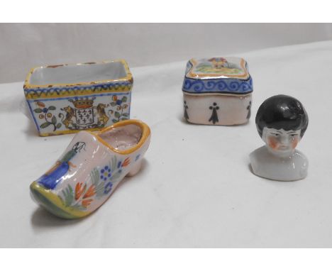 A small French faience lidded box with painted figural decoration - sold with a similar miniature vase of trough form, a Quim