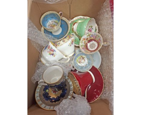 A box containing a quantity of bone china and porcelain cups and saucer including Paragon, Royal Worcester, etc.