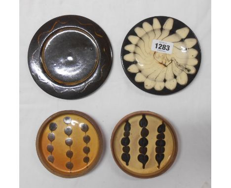 Four small pieces of Sidney Tustin Winchcombe Pottery slip decorated items comprising two dishes and two plates