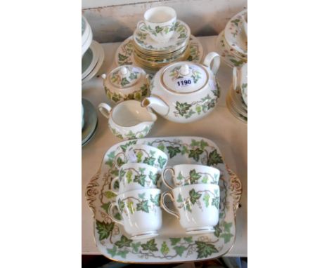 A Wedgwood bone china tea set decorated in the 'Santa Clara' pattern comprising teapot, milk jug, sucrier, six trios, bread p