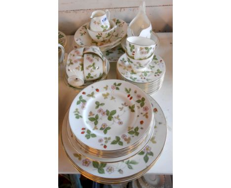 A quantity of Wedgwood bone china tableware decorated in the 'Wild Strawberry' pattern including cups and saucers, milk jug, 