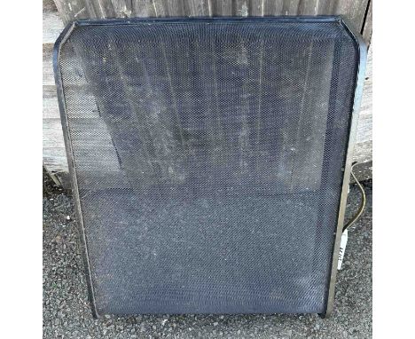 A black mesh fireguard