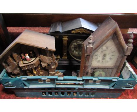 A collection of clocks to include a novelty German cuckoo clock, black slate architectural clock and a gothic style shelf clo