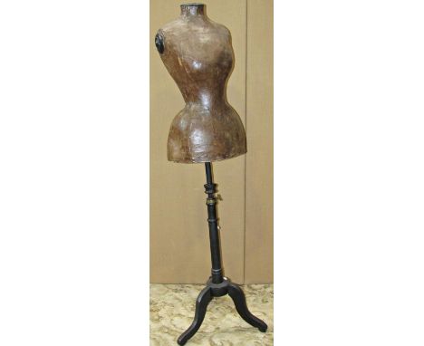 19th century female mannequin with tiny waist, in papier mache, raised on an adjustable painted pine wood stand, with tripod 