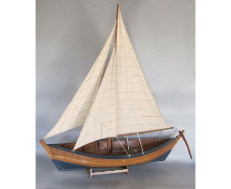 A good quality scale model pond yacht on stand, the stand inscribed Nauticalia of London, 80 cm long x 83 cm high 