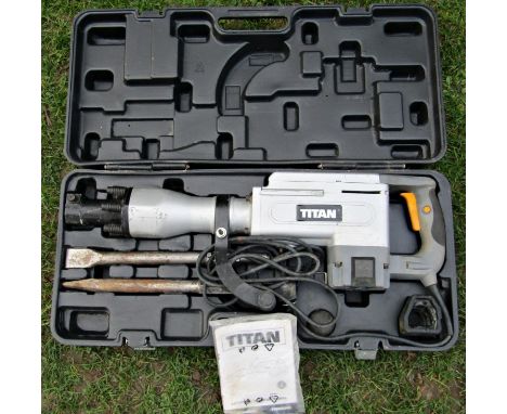 A Titan concrete breaker, 1700 watt, model number TTB280DRH with attachments, carrying case, together with safety operating m