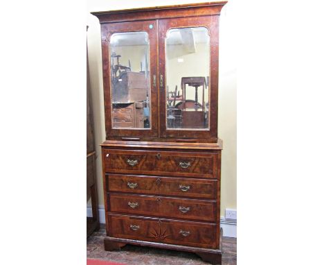 An 18th century walnut secretaire cabinet, the lower section enclosed by four drawers, the secretaire drawer simply fitted, t