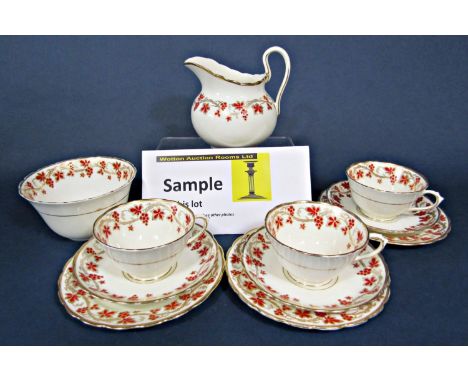 A collection of Tuscan China teawares with red and gilt fruiting vine decoration including milk jug, sugar bowl, twenty six c