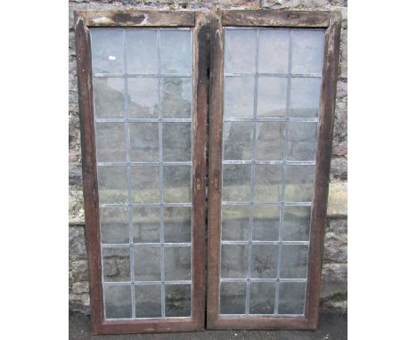 A pair of reclaimed oak framed oak framed windows of rectangular form with pegged joints and enclosing leaded light panels, 5