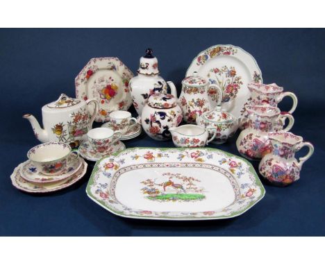 A collection of Masons Ironstone wares including three graduated Fruit Basket pattern jugs, a Mandalay vase and cover, a matc