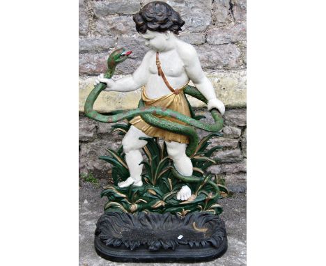 A vintage cast iron umbrella/stick stand in the form of young Hercules grasping a snake amongst foliage, with removable drip 