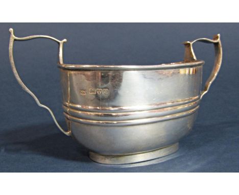 Early 20th century silver twin handled sucrier with embossed band, maker AM, Chester 1919, 15.5cm long, 4oz approx 