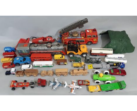 Mixed collection of unboxed vintage model vehicles including large tinplate fire engine, battery operated tinplate locomotive