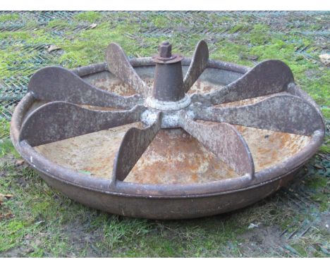A vintage cast iron Mexican hat shaped pig feeding trough, with unusual revolving fixed segments, stamped to central fitting 