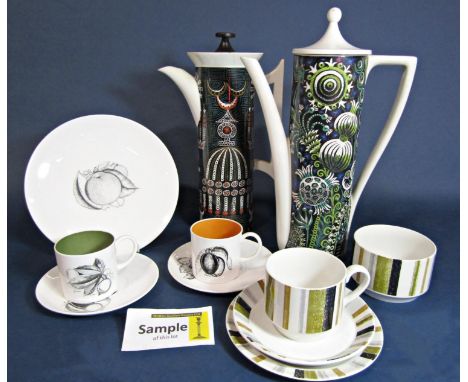 A set of Susie Cooper harlequin coffeewares with black and white fruit decoration and different colour interiors including co