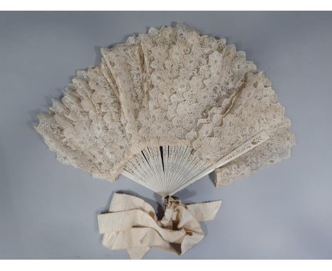 Vintage brise lace fan with painted wooden guards and sticks, each stick supporting a wide lace band. Guard length 27cm (1) 