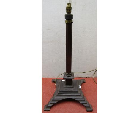 An ironwork lamp standard with reeded column on square cut platform base, 65 cm height 