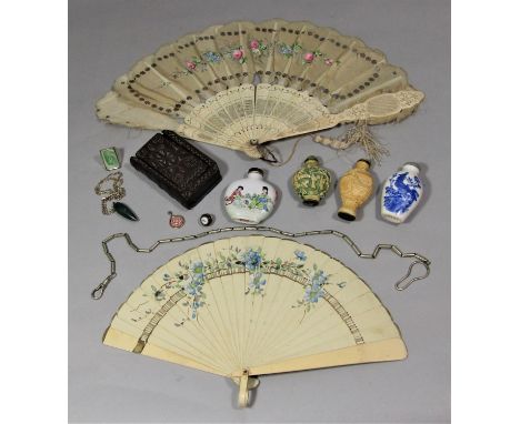 An early carved timber box with sliding cover in the form of a book, two 19th century fans, 20th century snuff bottles, etc 