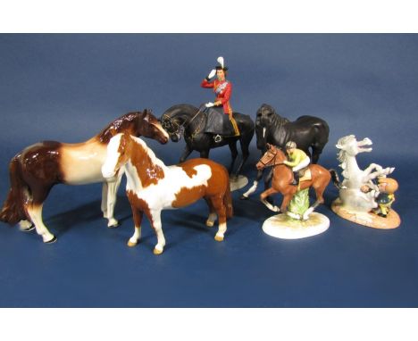 A collection of ceramic models of horses comprising a Beswick skewbald pony (af), a Beswick matt glazed black horse, a Royal 