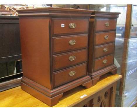 A pair of contemporary, but Georgian style, four drawer bedside chests/lamp tables raised on bracket supports, 53 cm wide x 4