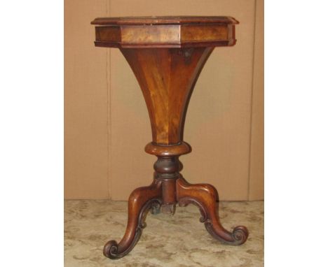 A Victorian walnut trumpet shaped workbox with floral marquetry detail, raised on a tripod base with scrolled supports, toget