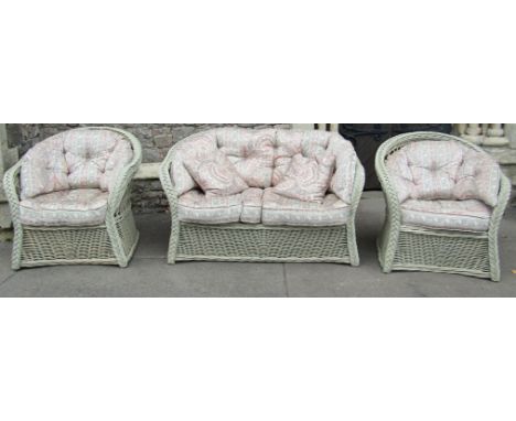 A contemporary wicker conservatory suite comprising a pair of two seat sofas, a pair of matching chairs, two circular glass t