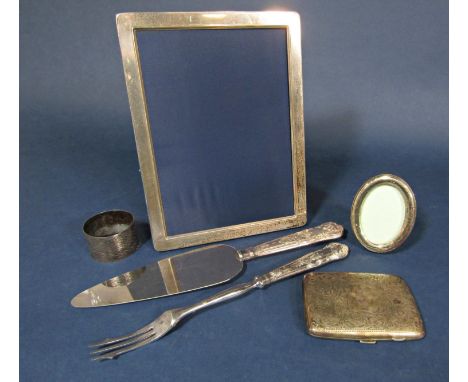 Mixed collection of silver comprising a silver photograph frame, a small oval applied frame, napkin ring, cigarette case and 