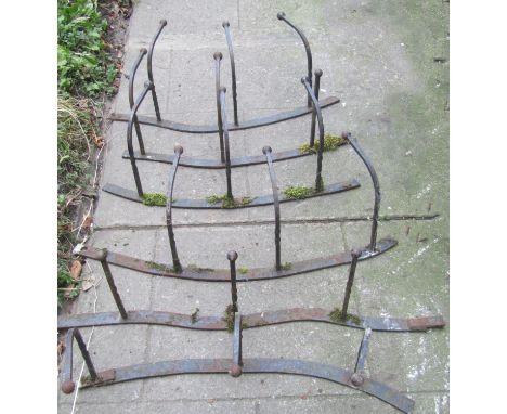 Eleven sections of reclaimed iron work wall mounted railing, probably originally for agricultural use 