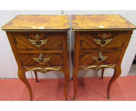 A pair of French bedside/lamp tables the rectangular top with parquetry detail fitted with two frieze drawers on shaped suppo