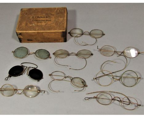 A collection of vintage gold rimmed spectacles 