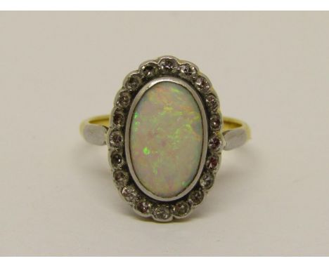 Good quality 18ct opal and diamond oval cluster ring, ring head 16 x 12mm approx, size K, 4g 