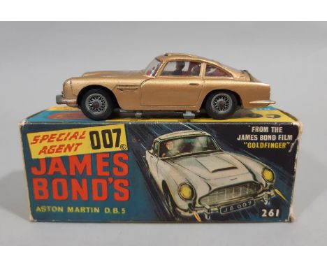 James Bond's Aston Martin DBS by Corgi ©1965 261 featuring  functioning retractable machine guns and ejector seat, with both 