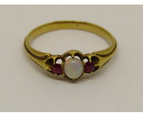 Yellow metal opal and ruby three stone ring, size M, 2.5g 