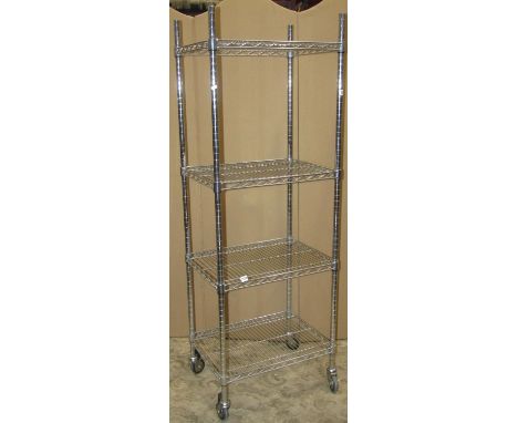 A polished chrome four tin rack in a vintage style on industrial castors, 175 cm in height, 60 x 45 cm 
