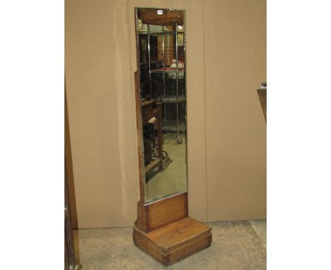 A small art deco cheval glass with stepped oak base supporting a bevelled edge mirror plate, 38cm wide 