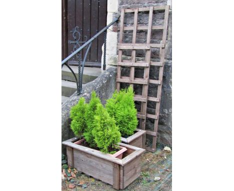 A galvanised trough of rectangular form with folded rim (planted0 94cm long x 50cm wide x 42cm high, together with a pair of 