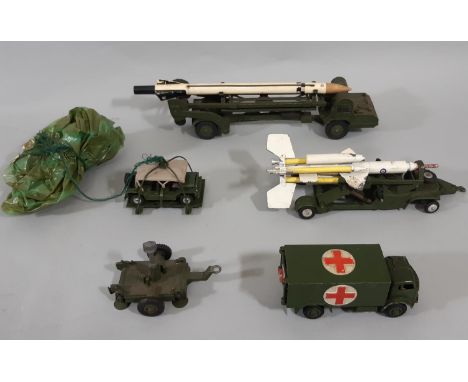 4 unboxed Dinky military model vehicles including Missile Erector, Military Ambulance, Missile Launching Platform, Austin Min