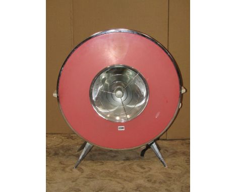 A vintage electric room heater in the Sofono catalogue number PRC402ST, the circular disc  in pink supporting a heating eleme