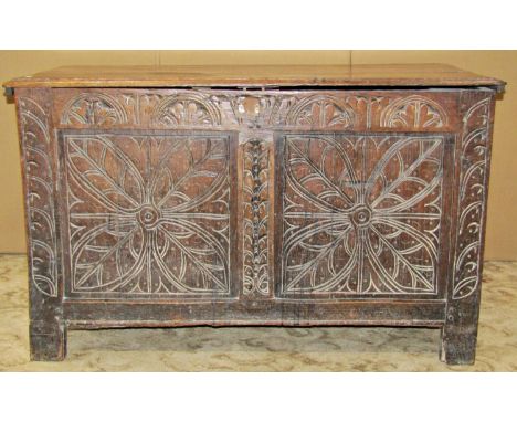 18th century oak coffer with rising lid, the panelled framework with repeating geometric carved detail (lacks steel lock plat