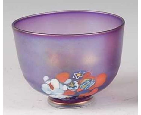 Bertil Vallien for Kosta Boda - an iridescent and floral enamel decorated circular footed table bowl, etched marks verso, dia