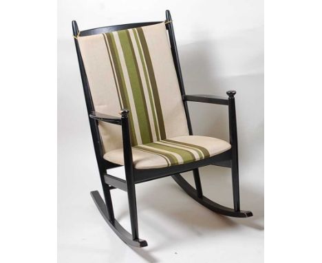 N. Eilersen - a 1960s ebonised ladderback rocking open armchair, having striped upholstered fixed pad seat with removable cus