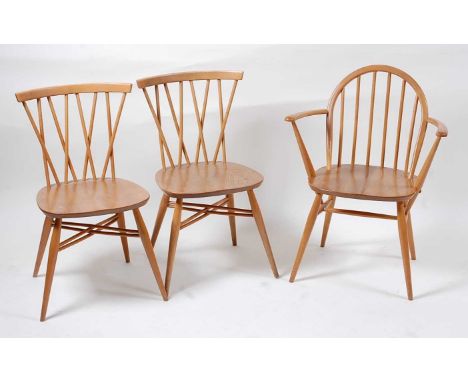 A pair of 1960s Ercol light elm stickback candlestick kitchen chairs, model No.3462, w.41cm; together with a further 1960s Er