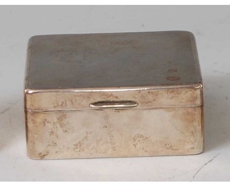 A 1950s silver table cigarette box, the hinged cover with engine turned decoration, enclosing a cedar lined interior, maker A