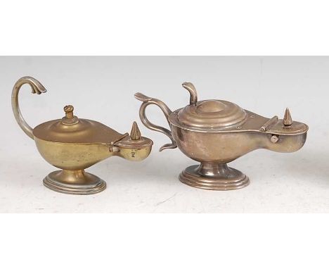 A 1930s Dunhill silver plated novelty table lighter in the form of a genie's lamp, the cover latch with hinged action, raised